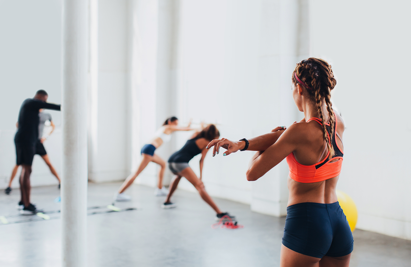 Young woman working out indoors.